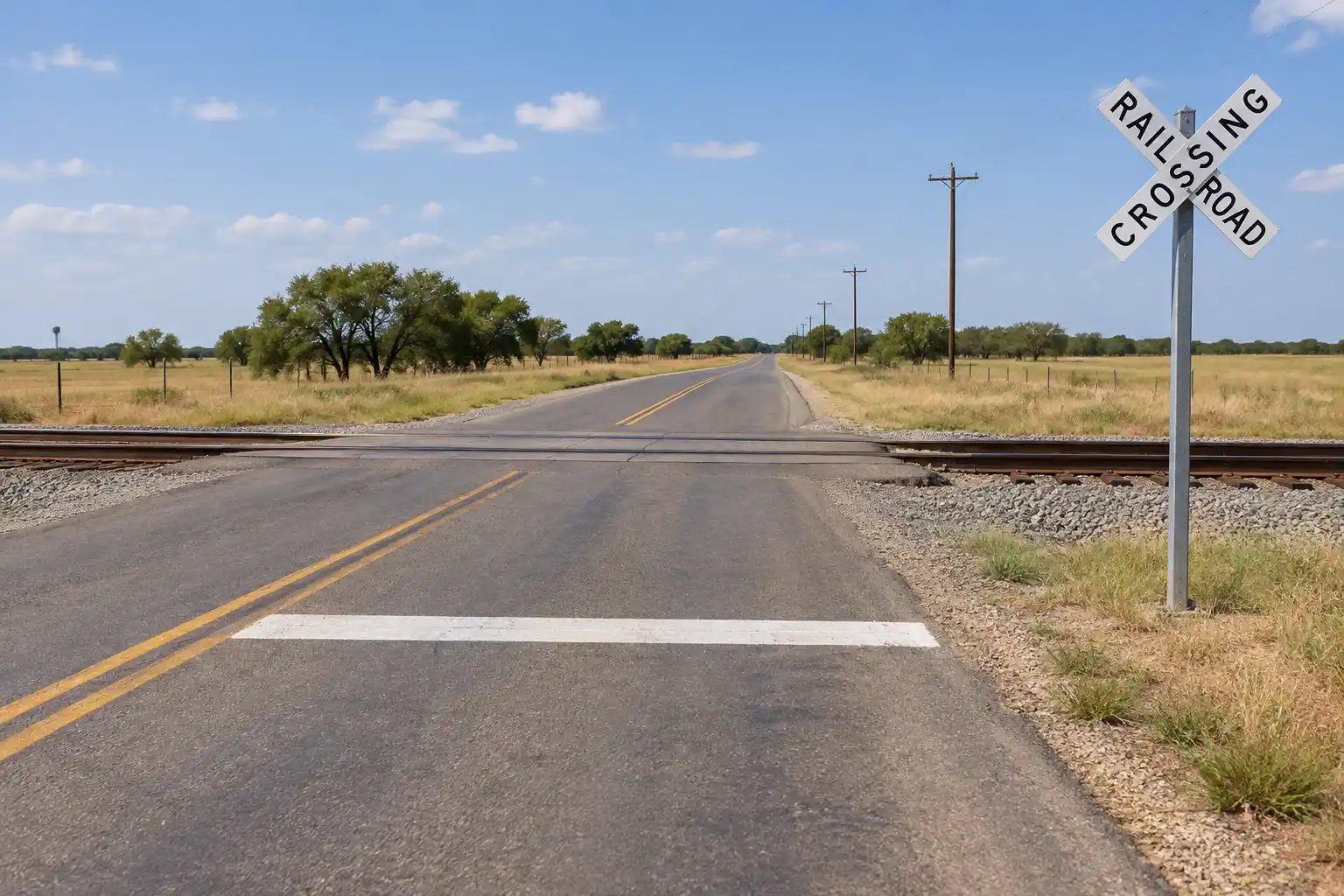 Railroad crossing with crossbuck sign and stop line in Texas